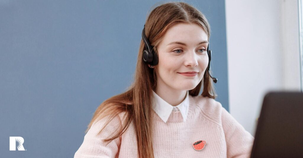 A pleasant agency customer service rep conducts a phone call.