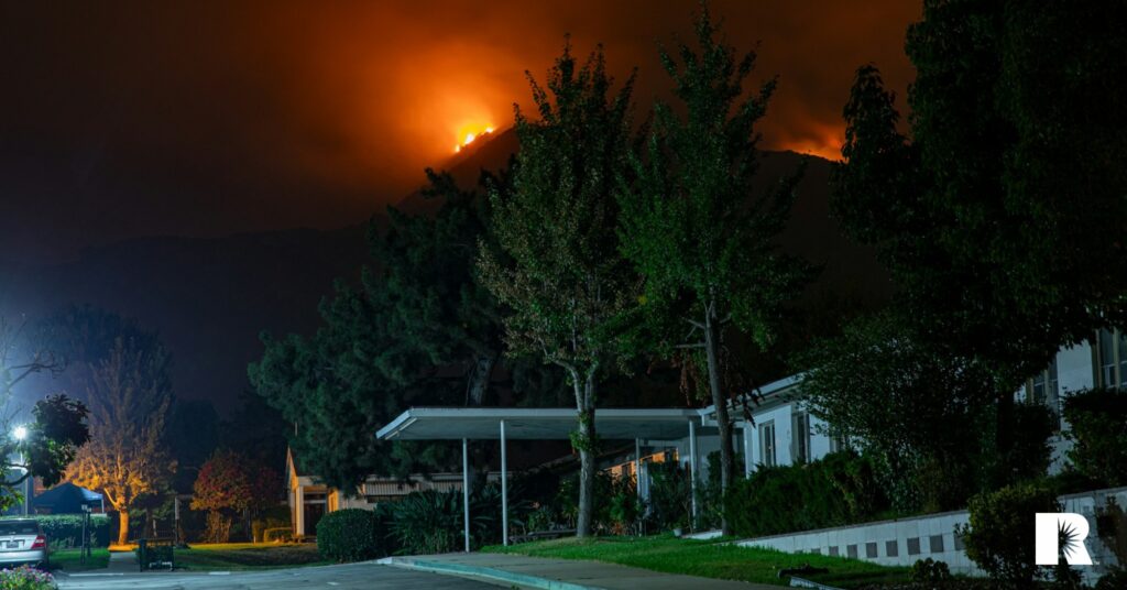 Wildfire creeps toward suburban homes in California.